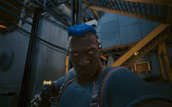 A cybernetic man with glowing red eyes and blue hair points a futuristic gun forward
