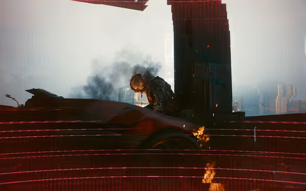A burning cybernetic figure leans over a wrecked car as smoke and sparks rise.
