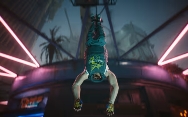 Muscular beheaded man hangs upside down by his feet in neon-lit urban environment.