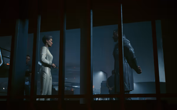 A woman in a white suit confronts a man in black behind a metal grate.