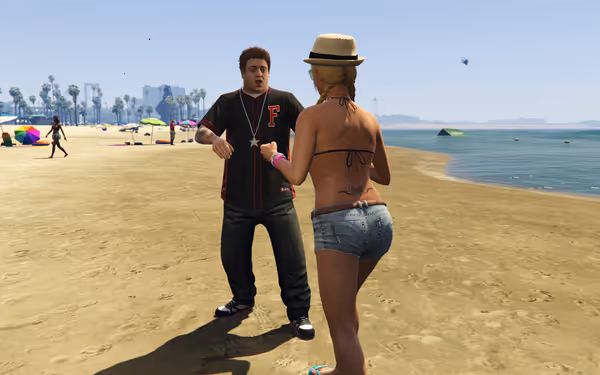 A man in a black shirt reacts as a woman confronts him on the beach.