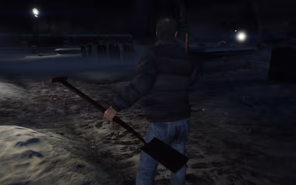 A man in a black jacket and jeans holds a shovel while walking through a snowy graveyard.