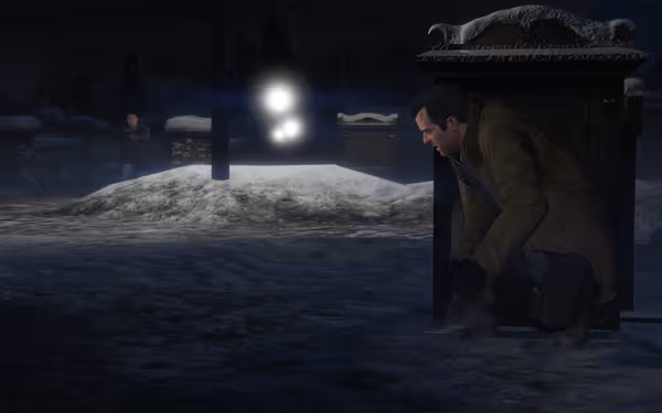 A man in a brown coat hides behind cover in snowy night while another armed man approaches.