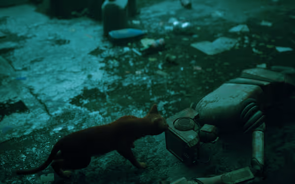 An orange cat sniffs a fallen robot lying on a dirty floor.